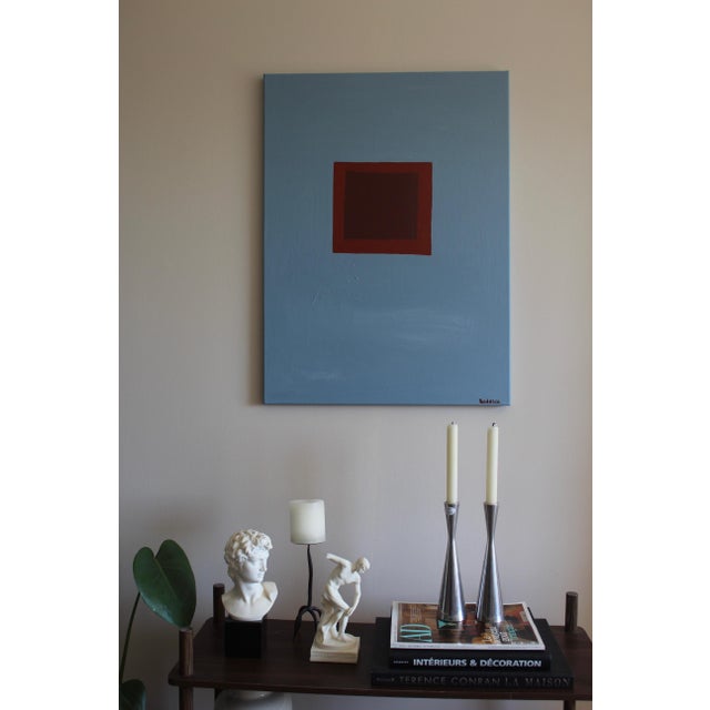 This artwork explores the subtle tension between structure and stillness. A deep, anchored square emerges at the center of...