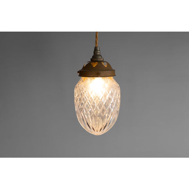 Pendant light with copper fitting and cut glass bowl. Re-wired and tested. Circa 1900. Up to 250V (Europe/UK Standard).The...