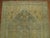 A throw size 20th century Persian Malayer rug with an all-over sun-faded mini-khani design in sand and light blue...