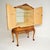 An exceptional antique burr walnut Queen Anne style cocktail drinks cabinet. This was made in England, it dates from...