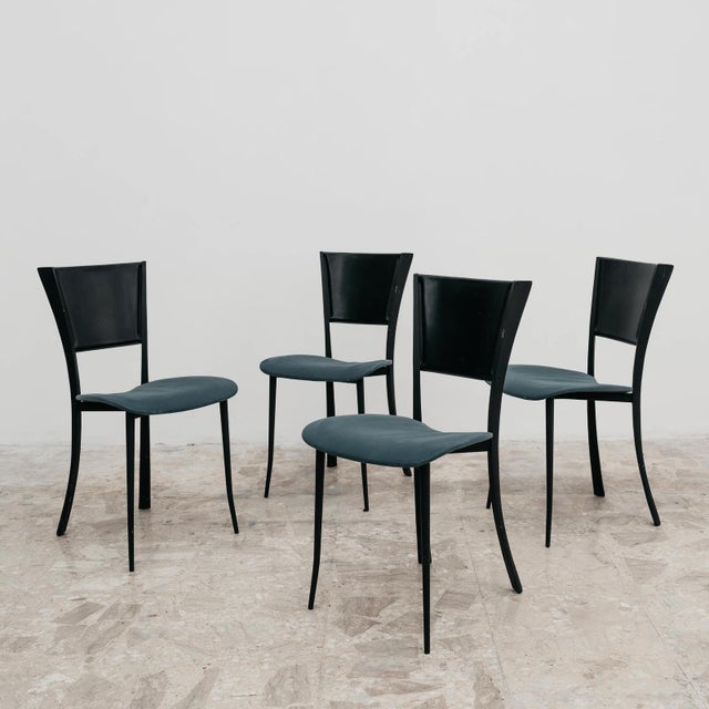 A stunning and captivating dining set of four original 1980s chairs, an excellent expression of postmodern design. This...