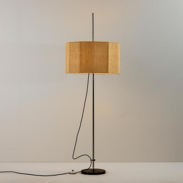Floor lamp with angular textile shade from the 1970s. The height of the lampshade is adjustable and there are three...