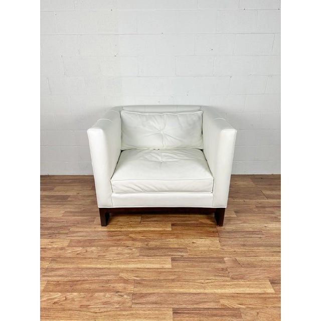 Pure form and simple elegance may best describe this supremely comfortable club chair. Deceptively “square," it envelops...