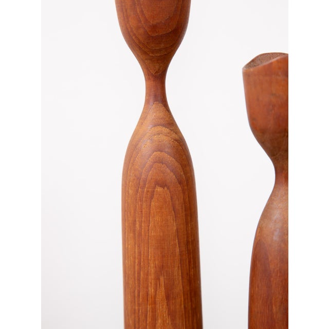 Mid-century modern Dansk style Tulip cut teak candlestick holders. Set includes 3 different sizes. Small: 8" high, 1.5"...