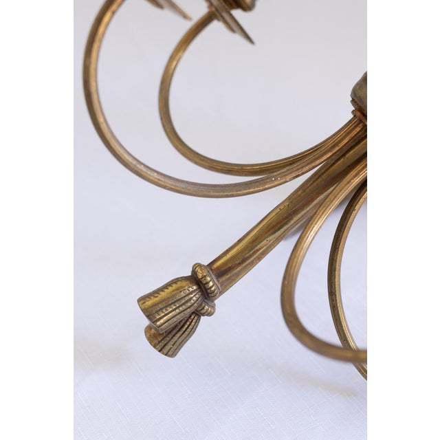 A charming and timeless example of classic French lighting, this vintage brass drape chandelier brings effortless elegance...