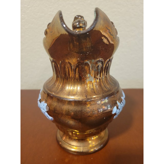 Copper Lustreware Ceramic Pitcher With Blue Jasperware Pattern. A nice early copper luster pitcher. Unmarked. Dates to the...