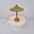 Exceptional and rare Italian table lamp from the 1970s, executed in richly polished solid brass with an extraordinary...