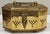 Vintage polished lidded brass cricket box. Perforated pierced design throughout on a footed base. Angular shape. Natural...