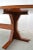 Hugh wooden table with beautiful and particular details in the style of Gianfranco Frattini. Excellent craftsmanship in...