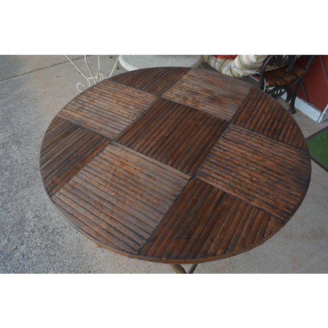 This is a great little vintage table! Looks to have had many years of love/use. Still sturdy. Would benefit from some oils...