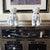 A commanding and mirrored pair of vintage 20th-century Dehua-style porcelain Guardian Lions. These "Blanc de Chine"...