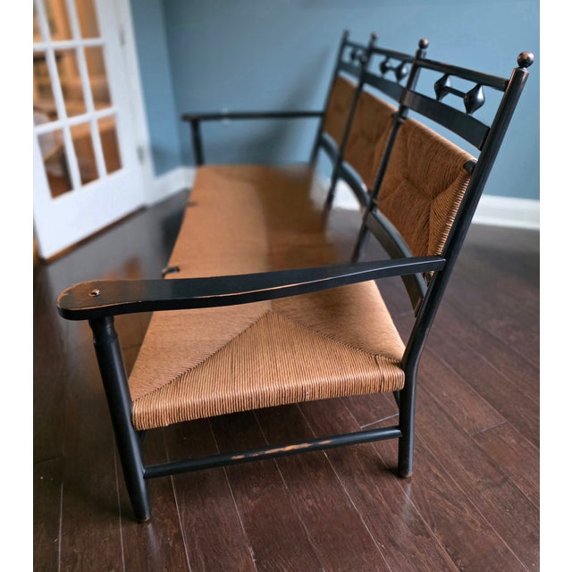 Beautiful custom sofa with cushions upholstered in a Cowtan & Tout fabric. Black frame, lightly distressed in its finish...