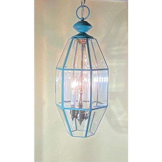 exquisite, vintage hexagonal hanging lantern , features a solid brass interior chandelier with a three-light cluster,...