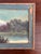 This charming antique hand-painted oil landscape captures a tranquil lakeside scene with a winding path leading toward a...