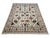 This Sultani wool area rug features a warm beige field with a Persian-style botanical design. Flowing vines, flowers, and...