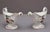 A decorative pair of early 19th Century high footed sauceboats, possibly Worcester porcelain, elegant scroll handles and...