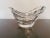 Baccarat crystal bowl from the Wave collection, in the shape of a boat with ripples running along its length on three...