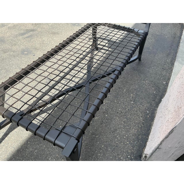 Sophisticated modern chaise lounge in the manner of Robsjohn Gibbings Klismos. The chaise has a dark espresso finish, with...