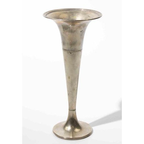 Elegant silver-plated trumpet vase featuring a tall, tapered silhouette with a wide flared rim and stepped circular base....