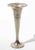 Elegant silver-plated trumpet vase featuring a tall, tapered silhouette with a wide flared rim and stepped circular base....