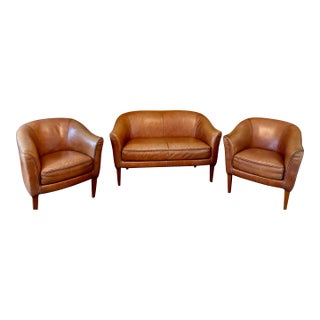 1930s Mid-Century Cognac Leather Loveseat + Pair of Barrel Chairs For Sale
