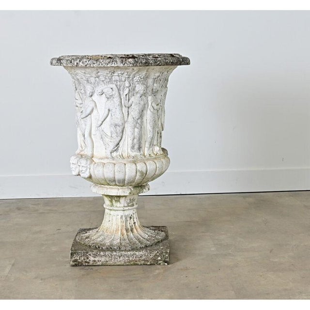 An exceptional cast-stone planter dating to Victorian England, copied after the “Medici Vase” from ancient Greece that...