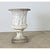 An exceptional cast-stone planter dating to Victorian England, copied after the “Medici Vase” from ancient Greece that...