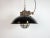 Industrial hanging lamp manufactured by Elektrosvit in former Czechoslovakia during the 1960s. It features a black enamel...