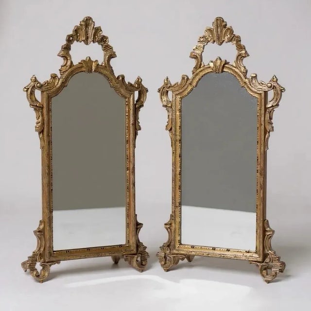 This is a pair of petite mid-century Italian mirrors with French rococo styling. The Italian artisans did an excellent job...