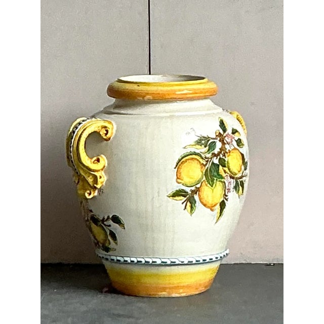 Infuse your home with Mediterranean charm with this delightful Vintage Italian Glazed Ceramic Lemon Urn. This exquisite...