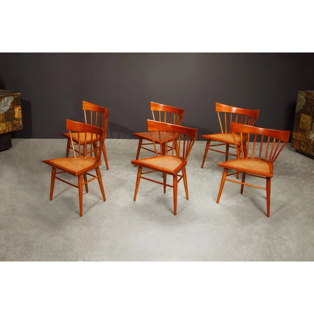 This set of six classic mid-century modern Mahogany and cane 'Yucatan' dining chairs was designed by Swedish designer...