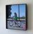 Figurative Traces by Emma Kalff | Oil on panel Girl riding a purple bicycle on a sunny street. For Sale - Image 3 of 5