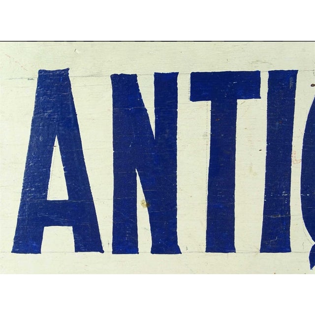 Vintage “Antiques” wooden painted trade sign. Circa Late 20th Century