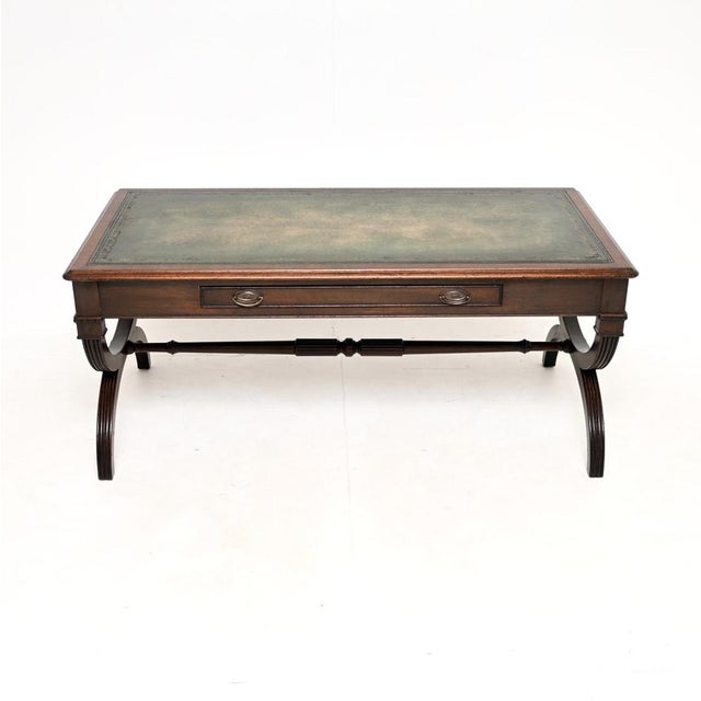 A large and impressive antique Regency style leather top coffee table. This was made in England, it dates from around the...