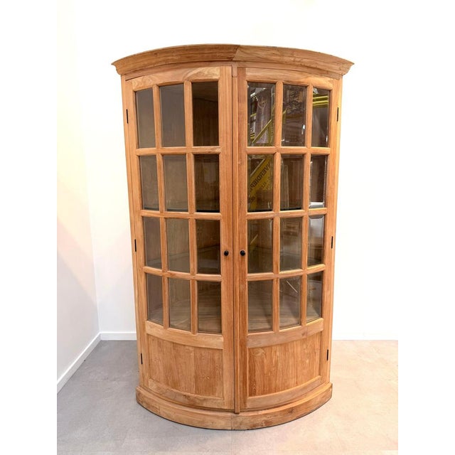 Bring warmth and character into your interior with this impressive curved display cabinet, crafted from high-quality...