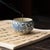 This is a vintage ceramic incense holder in the style of traditional Ru ware. The piece features a classic rounded form...
