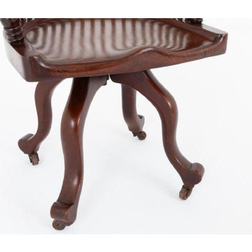 Victorian mahogany desk chair This rather unusual desk chair is braised upon shaped legs with fitted castors Circa 1880...