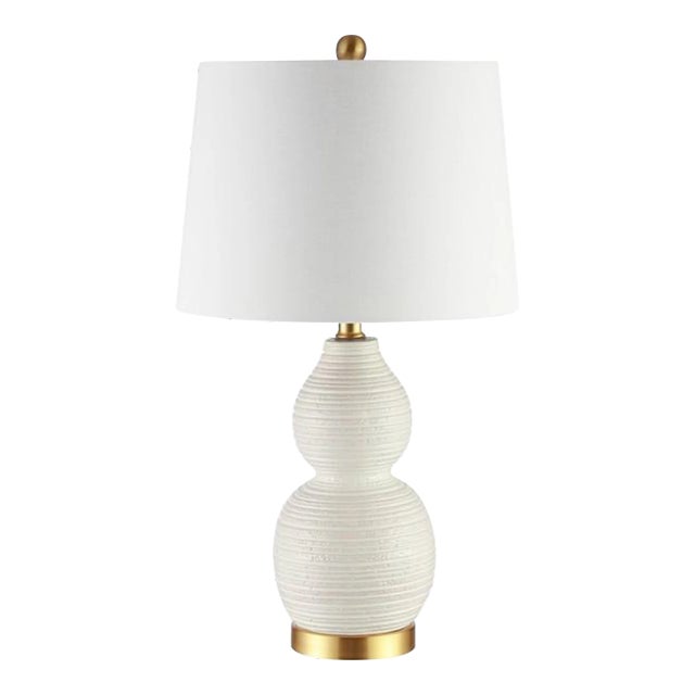 A masterful display of sculptural artistry, this Darsa Lamp is a striking addition in any room. The rippling texture on...