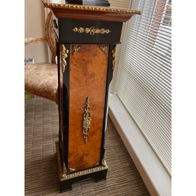 A lovely 19th century French Empire style reproduction, from 1980s. The vibrant and deep tones of the wood are...