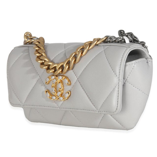 Item #: T146437 Interior Material: Fabric Dimensions: 7 x 4 x 1.5 in Handbag Closure Type: Magnetic Snap Handle Drop: 1.75...