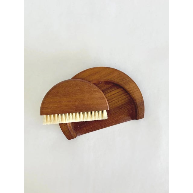 Crumb brush and tray set designed by Kay Bojesen, produced in Denmark in the 1950s. Made from teak with natural bristles,...
