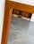 Danish wall mirror crafted in solid teak, featuring a clean rectangular form and warm natural wood grain. The minimalist...