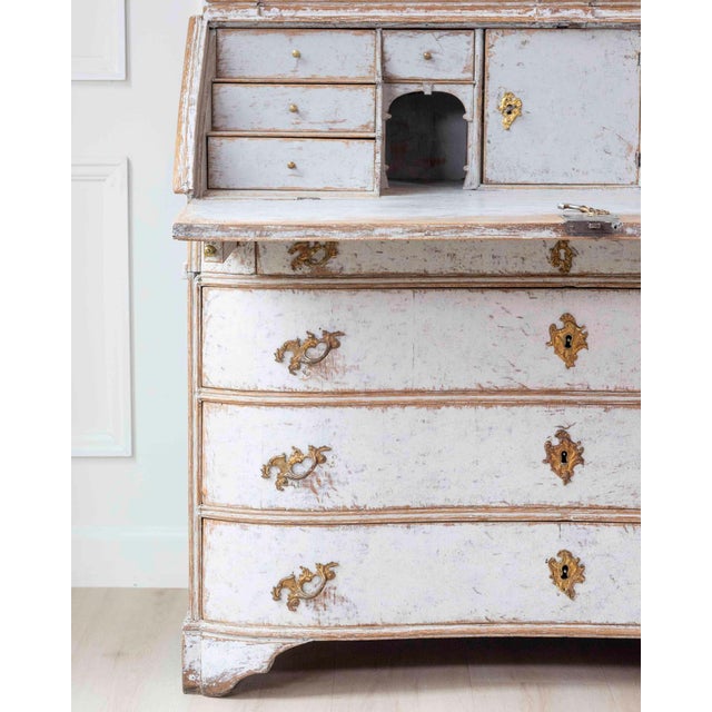 A Danish secretary dating to the 18th century , in the Rococo style. Finished in a soft grey and with a blush grey...