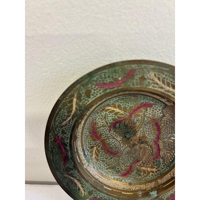 A charming vintage find for the collector of global decor — this small brass dish features an intricately hand-etched...