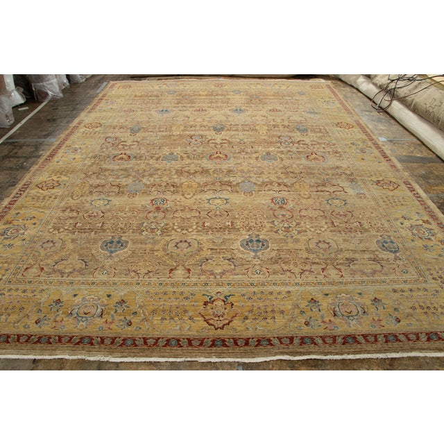 Hand knotted in wool, this 10x14 rug is inspired from antique Agra rug styles, and is the latest exciting addition to Rug...