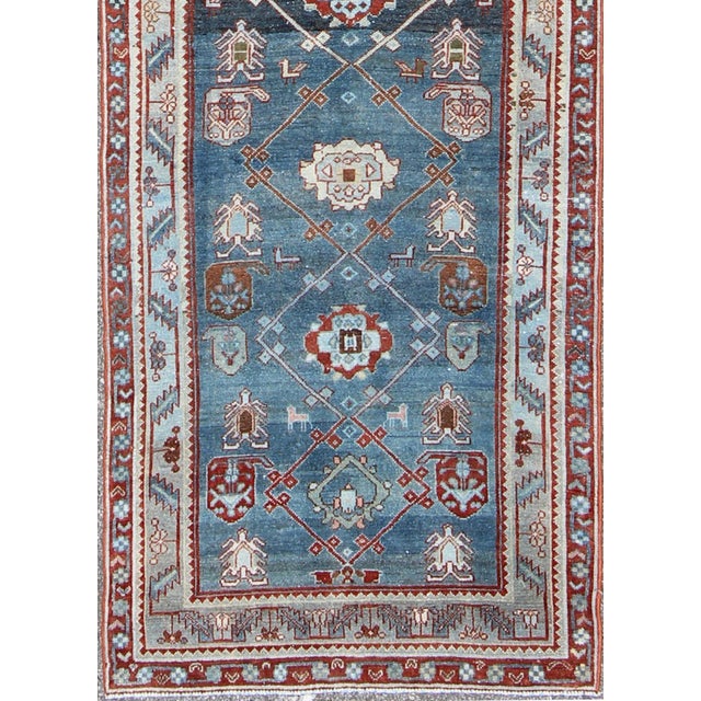 Measures: 3'1 x 12'5.. Vintage Persian Malayer runner with red geometric design and blue background. Keivan Woven Arts /...