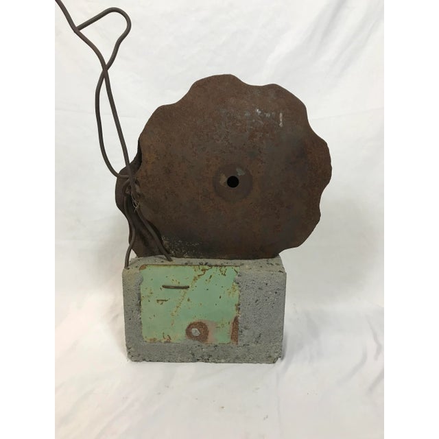 Upcycled farm equipment harrow disc and cast concrete sculpture. Overall this work is 31 inches tall, 18 wide and 12 deep....
