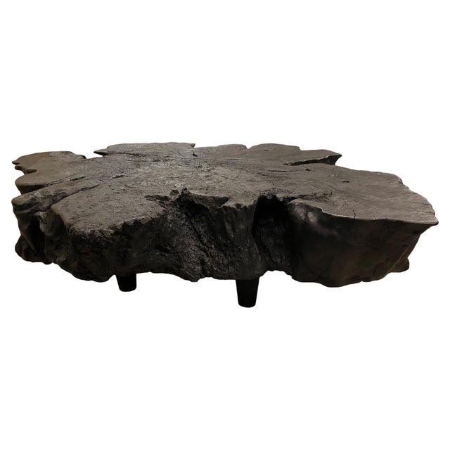 Hand carved reclaimed lychee root coffee table floating 8" off the floor. A slight graduation from the bottom to the top...