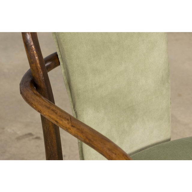 A refined pair of mid-20th century bentwood armchairs by Thonet, stamped and marked Made in Czechoslovakia, sourced in...