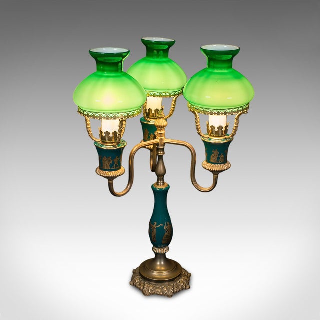 This is a vintage three branch table lamp. An English, ceramic and glass accent light in Neoclassical taste, dating to the...